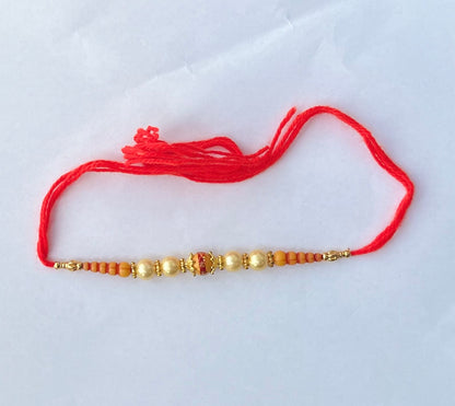 Orange Golden Beads Rakhi (1pc)