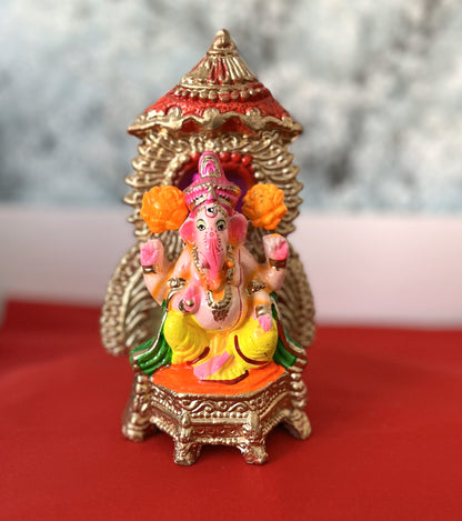 Ganesha In Sinhasan With Chhtra And Orange Flower (20cm)