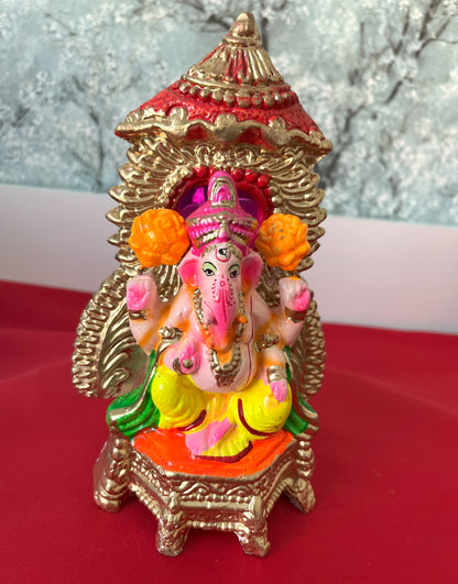 Ganesha In Sinhasan With Chhtra And Orange Flower (20cm)